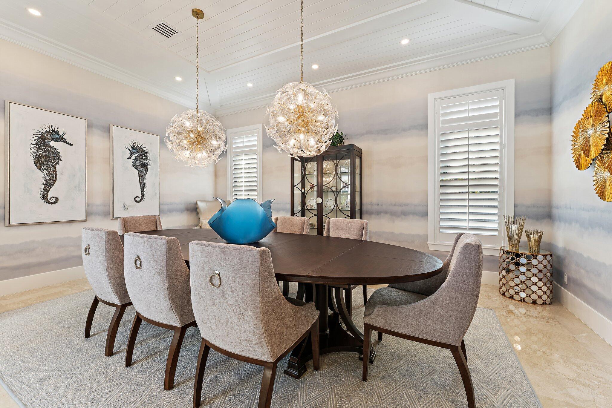 5730 Holly Lane Jupiter, FL 33458 - Photo 23 of 58 a view of a dining room with furniture and chandelier