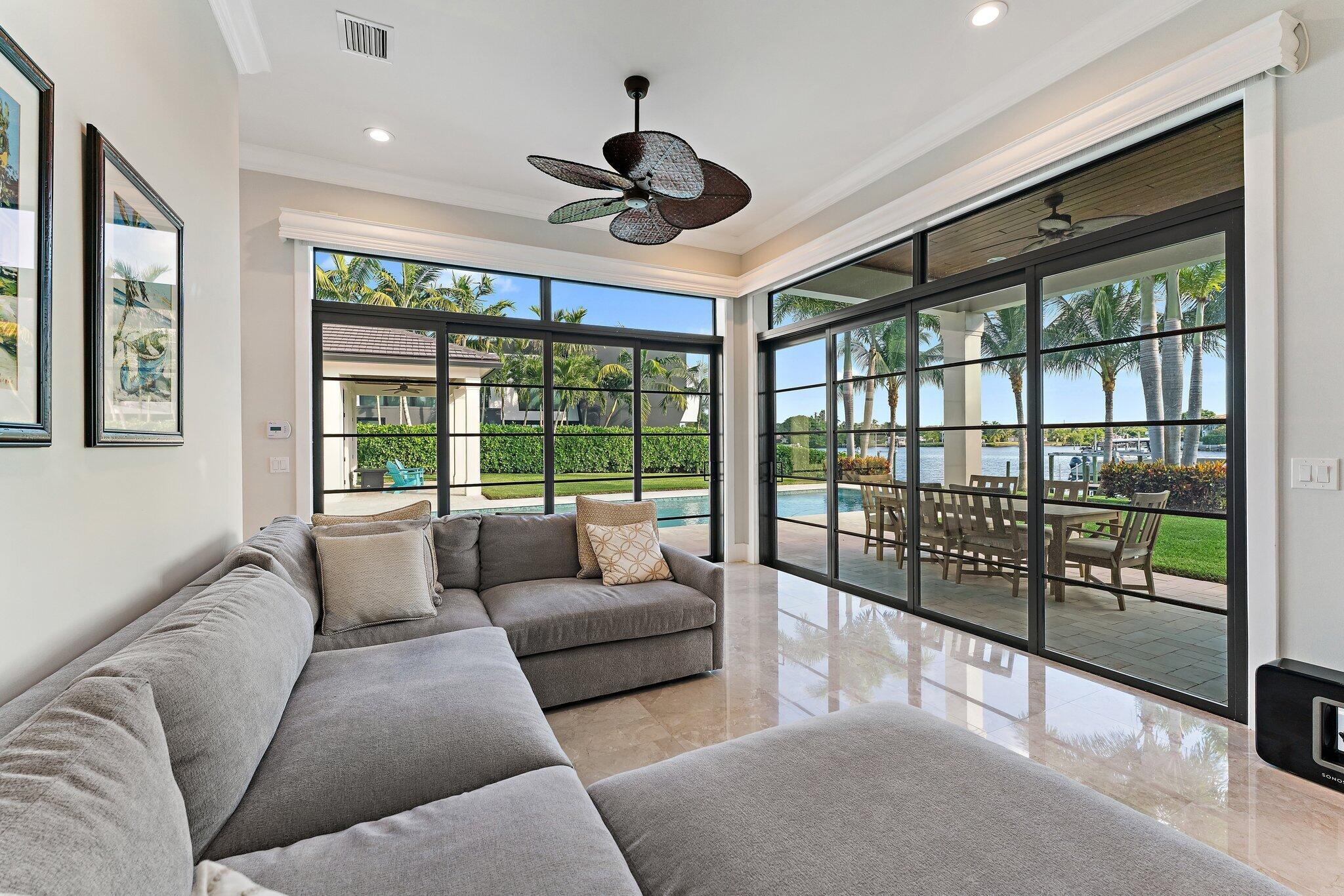 5730 Holly Lane Jupiter, FL 33458 - Photo 27 of 58 a living room with furniture and a large window