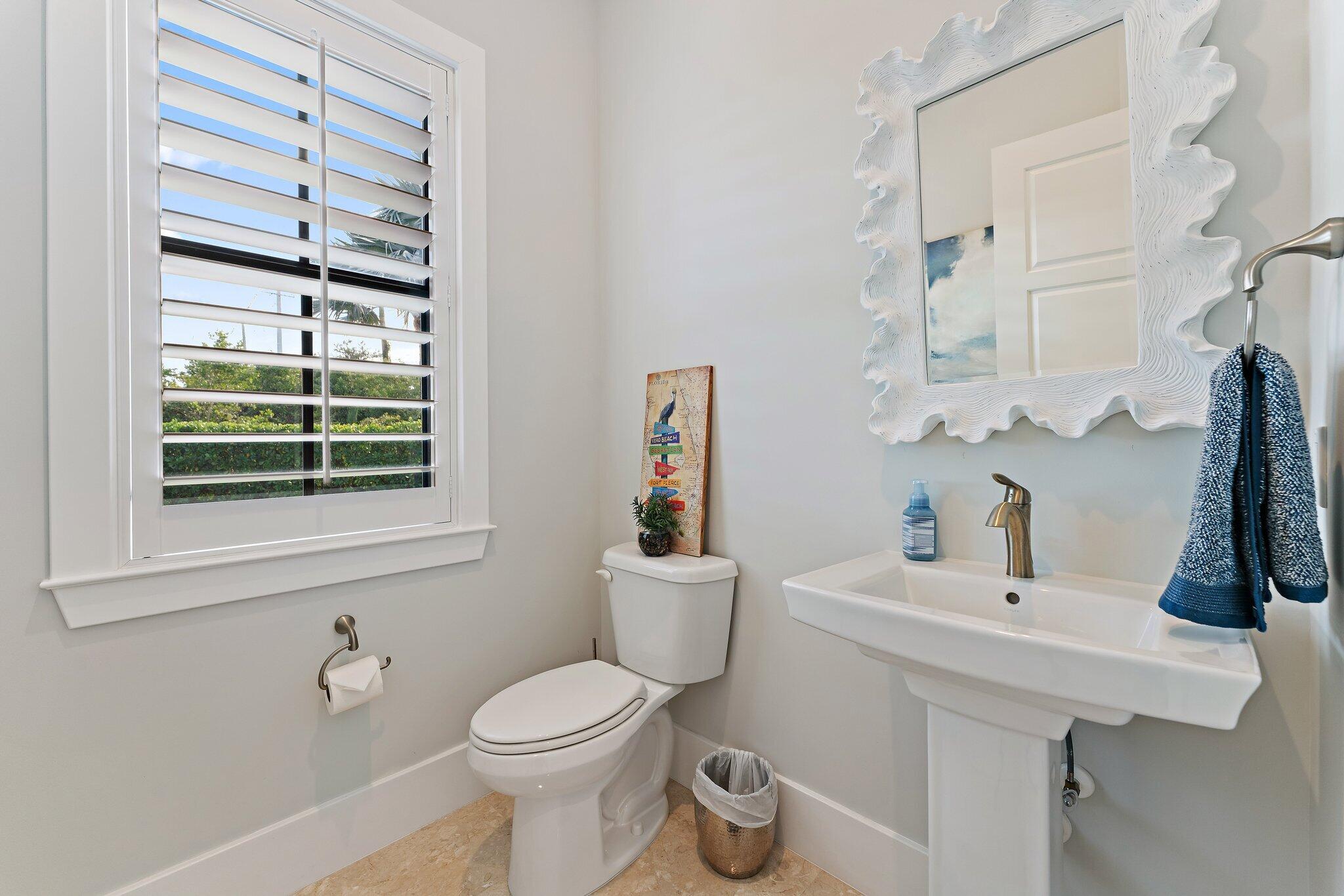 5730 Holly Lane Jupiter, FL 33458 - Photo 28 of 58 a bathroom with a sink toilet and window