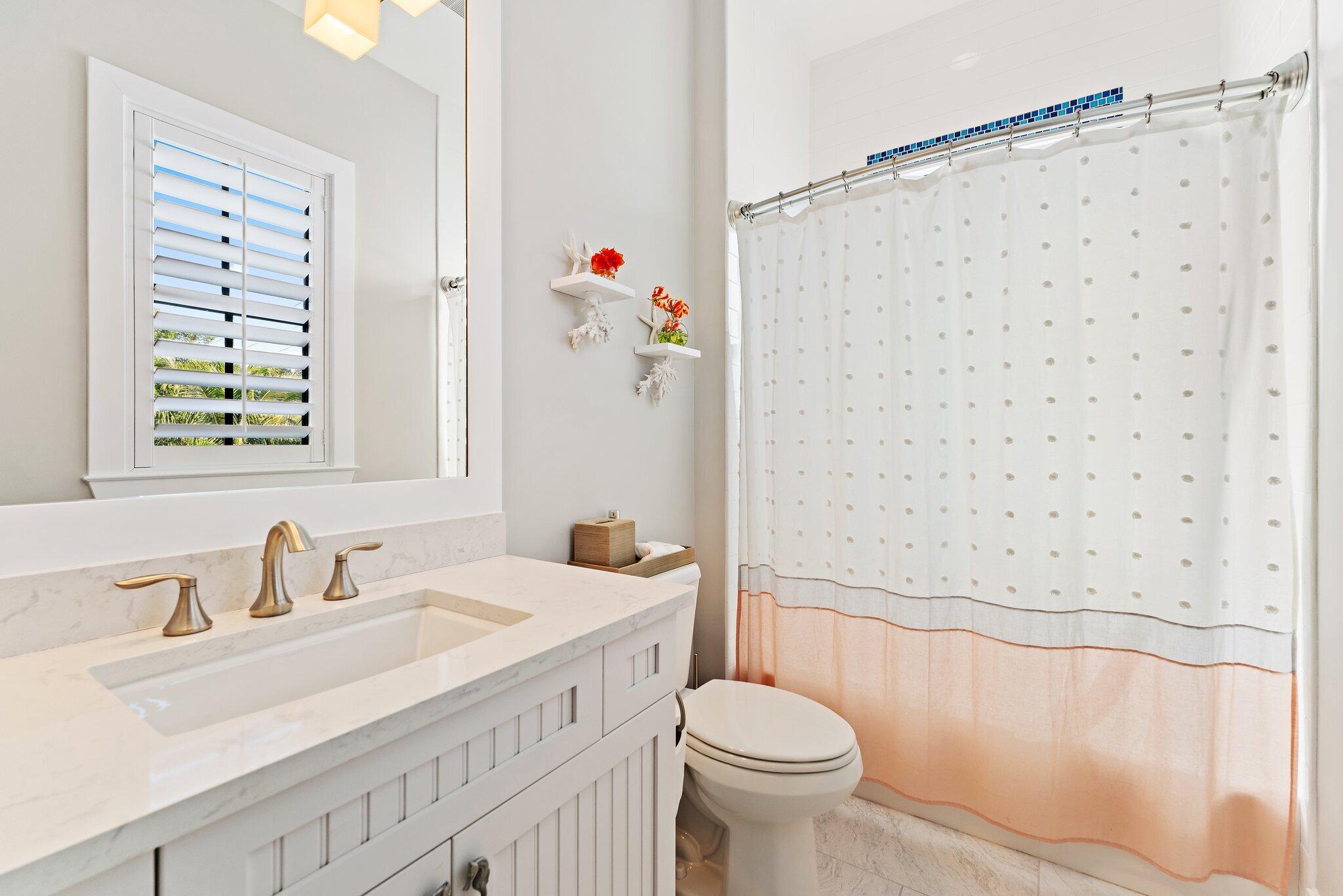 5730 Holly Lane Jupiter, FL 33458 - Photo 46 of 58 a bathroom with a sink toilet and shower