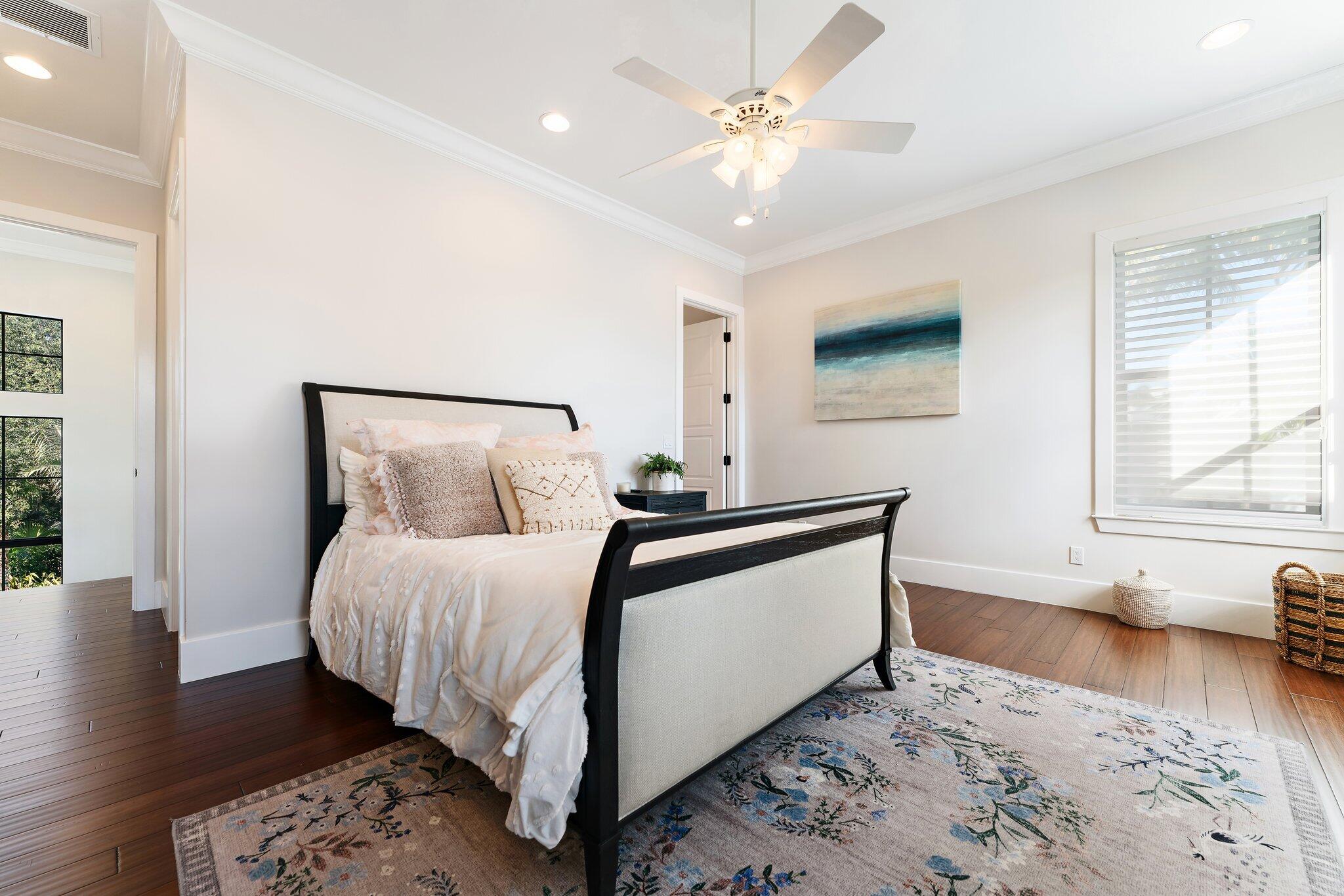 5730 Holly Lane Jupiter, FL 33458 - Photo 47 of 58 a bedroom with a bed and a window