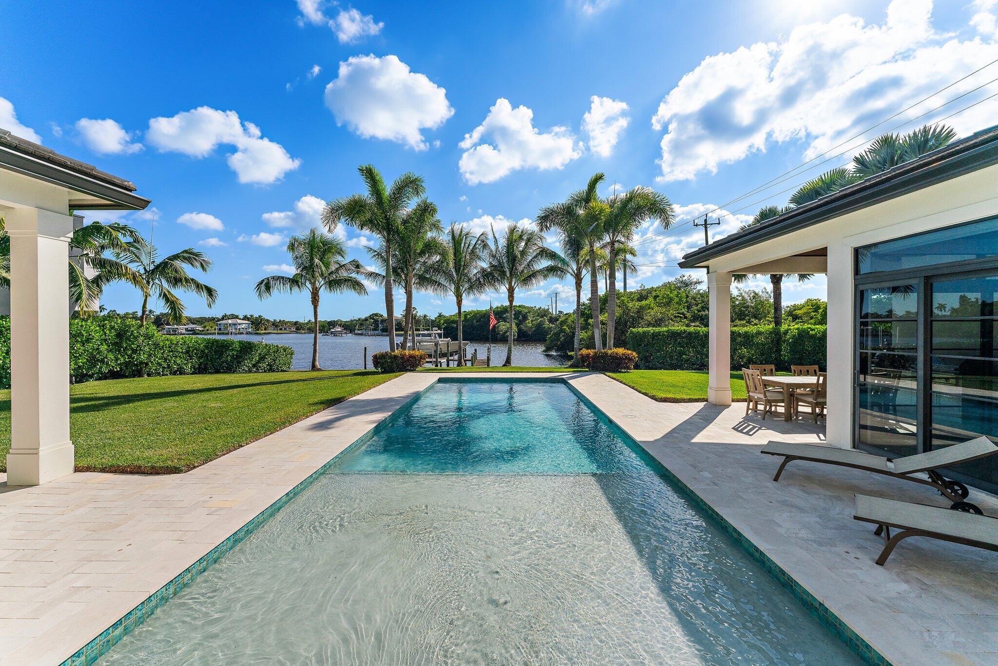 5730 Holly Lane Jupiter, FL 33458 - Photo 50 of 58 a view of swimming pool with seating area and slide