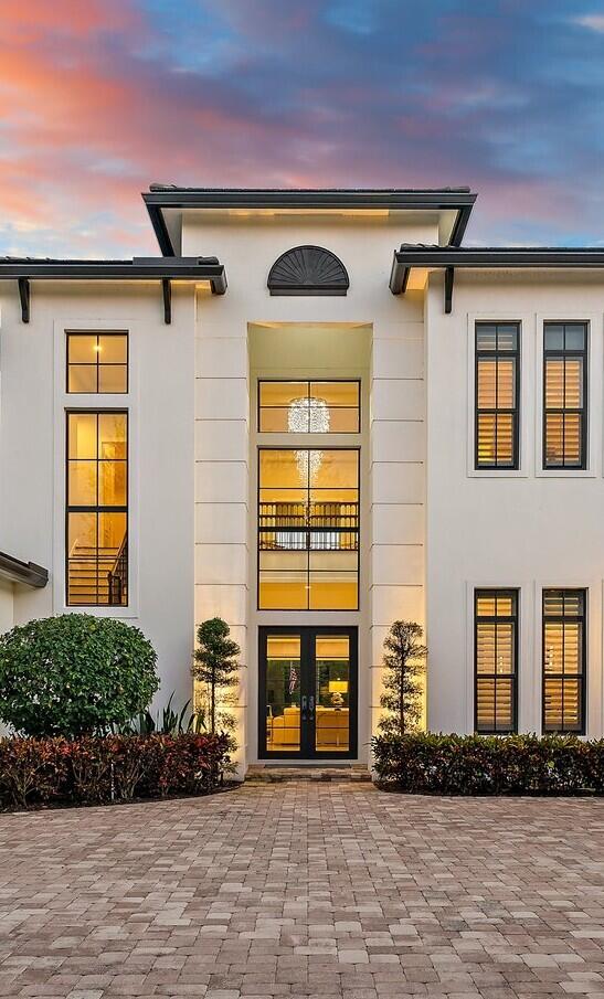 5730 Holly Lane Jupiter, FL 33458 - Photo 5 of 58 a front view of a house with a yard