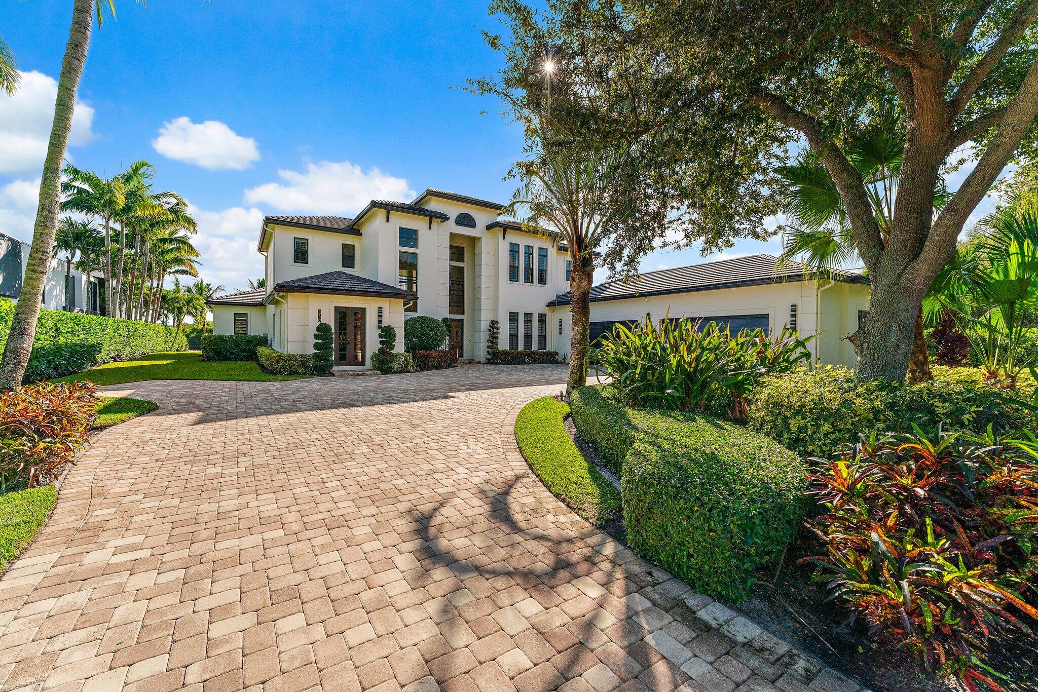 5730 Holly Lane Jupiter, FL 33458 - Photo 53 of 58 a front view of a house with a yard