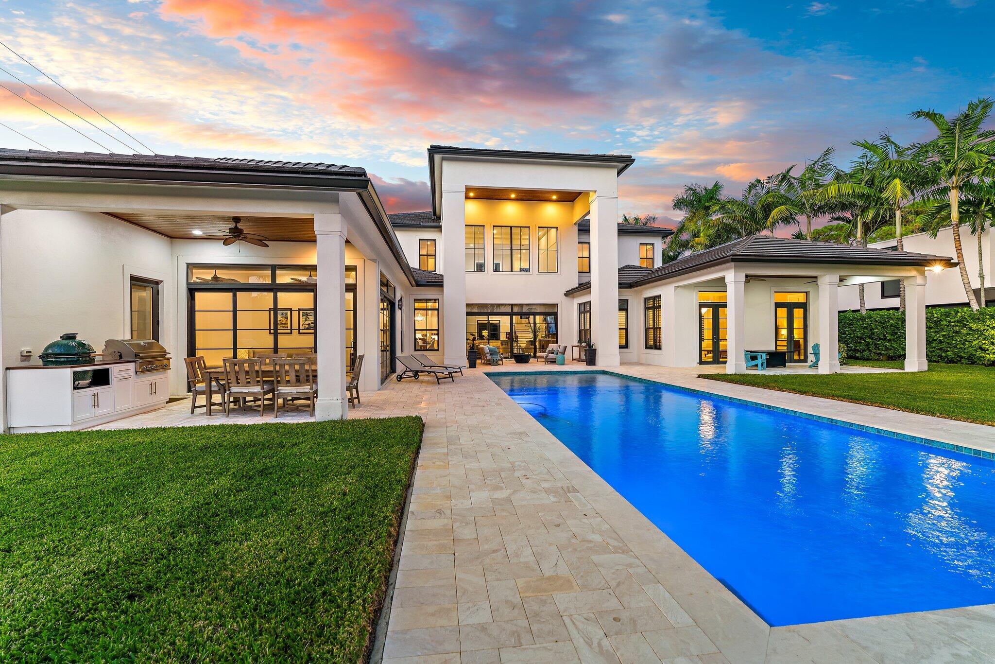 5730 Holly Lane Jupiter, FL 33458 - Photo 56 of 58 a view of a house with a swimming pool