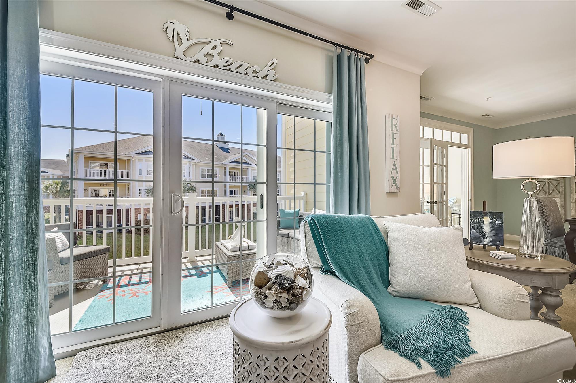 1029 Ray Costin Way, Unit VILLA 906 Murrells Inlet, SC 29576 - Photo 9 of 40 Living area featuring plenty of natural light