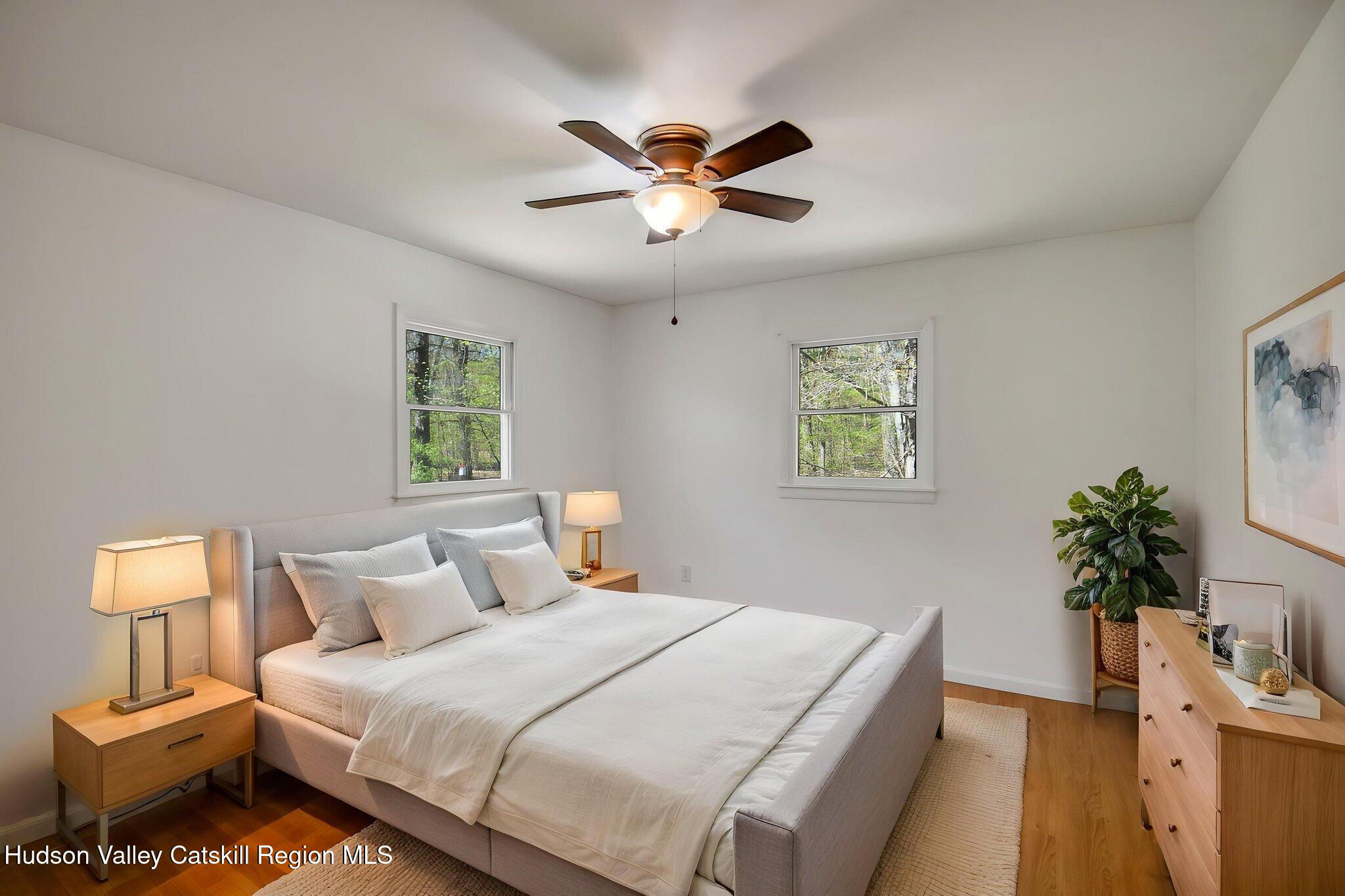 81 Mountain Turnpike Road Catskill, NY 12414 - Photo 13 of 36 a bedroom with a bed and a window