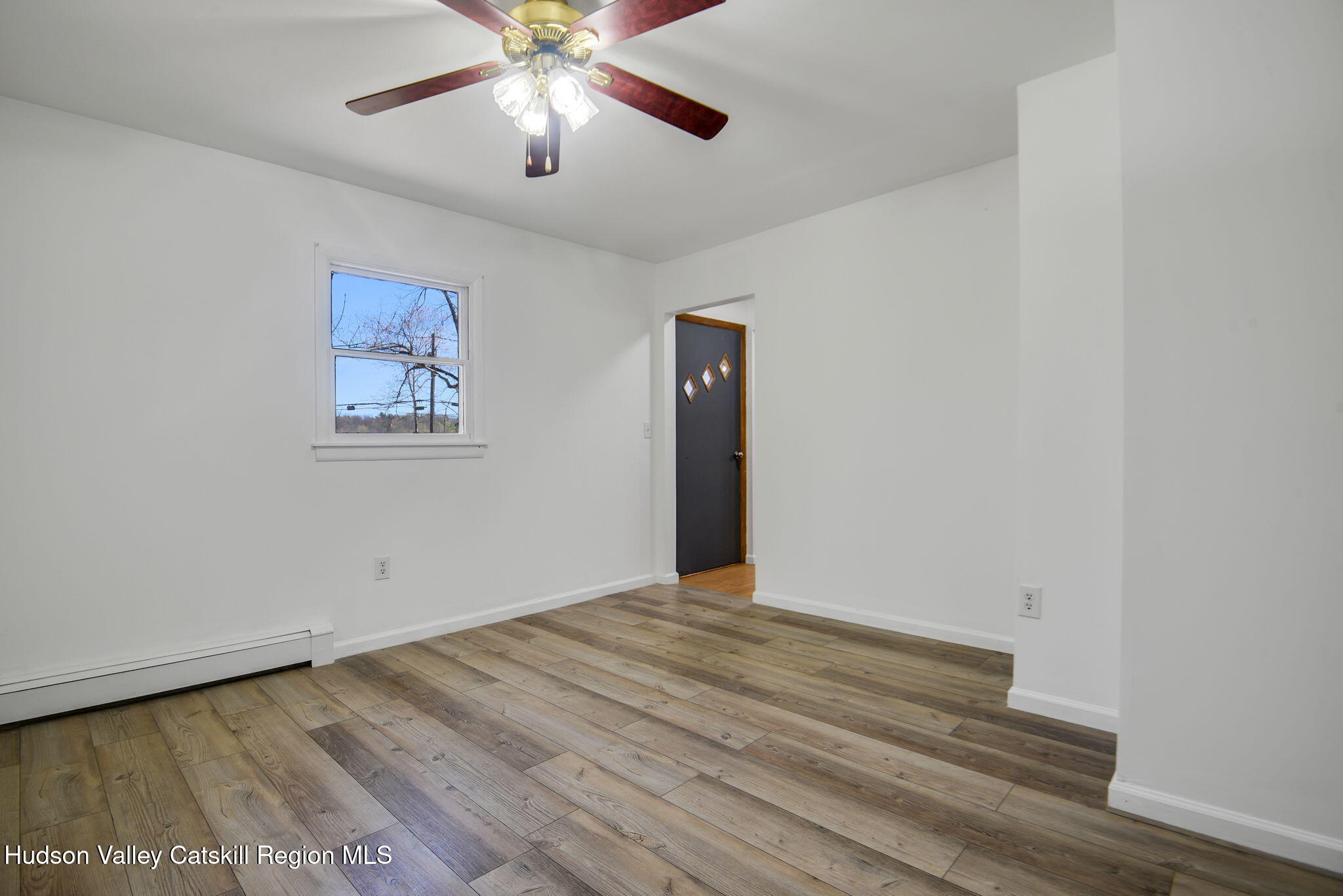 81 Mountain Turnpike Road Catskill, NY 12414 - Photo 15 of 36 a view of an empty room with a chandelier fan