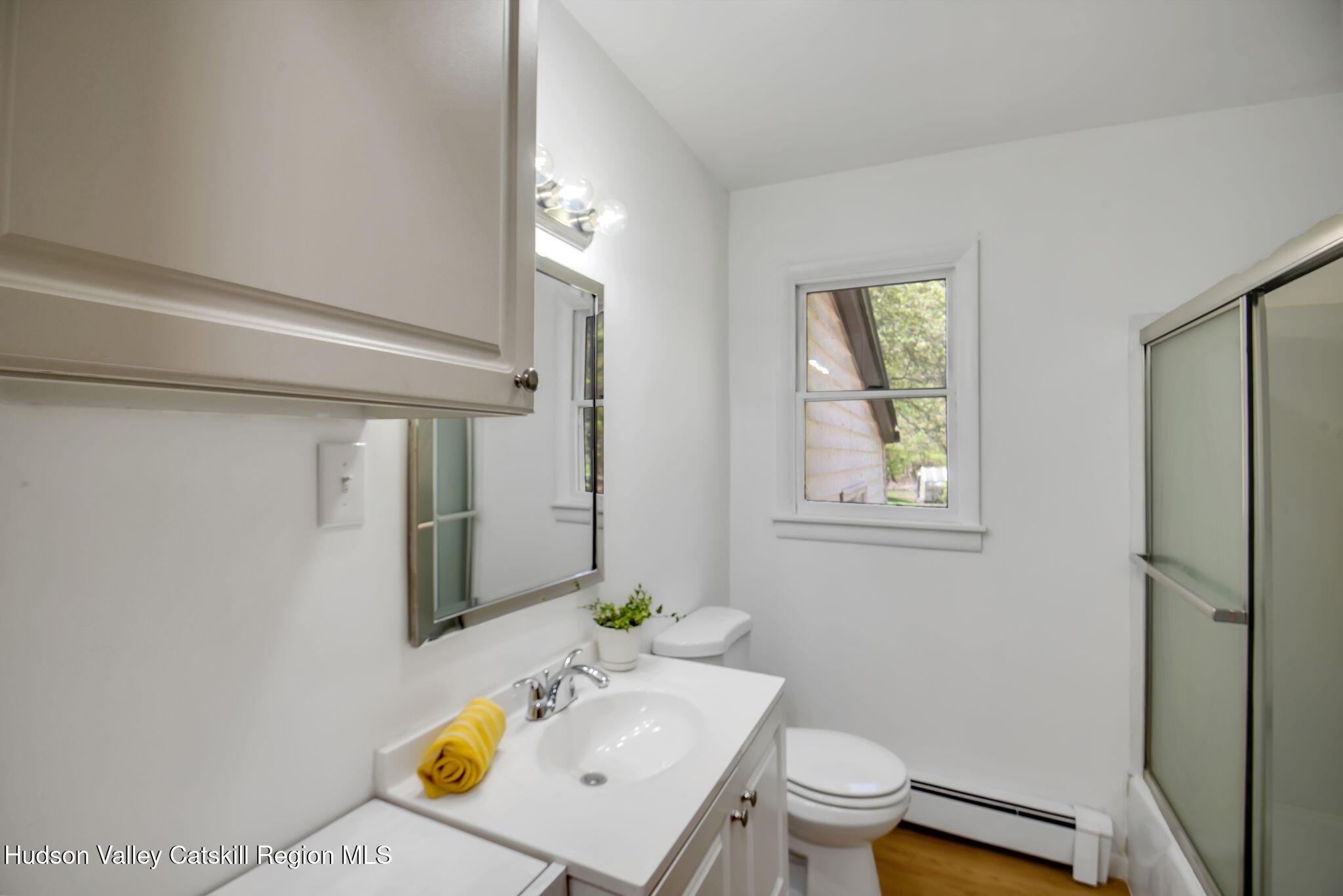 81 Mountain Turnpike Road Catskill, NY 12414 - Photo 17 of 36 a bathroom with a sink toilet and shower