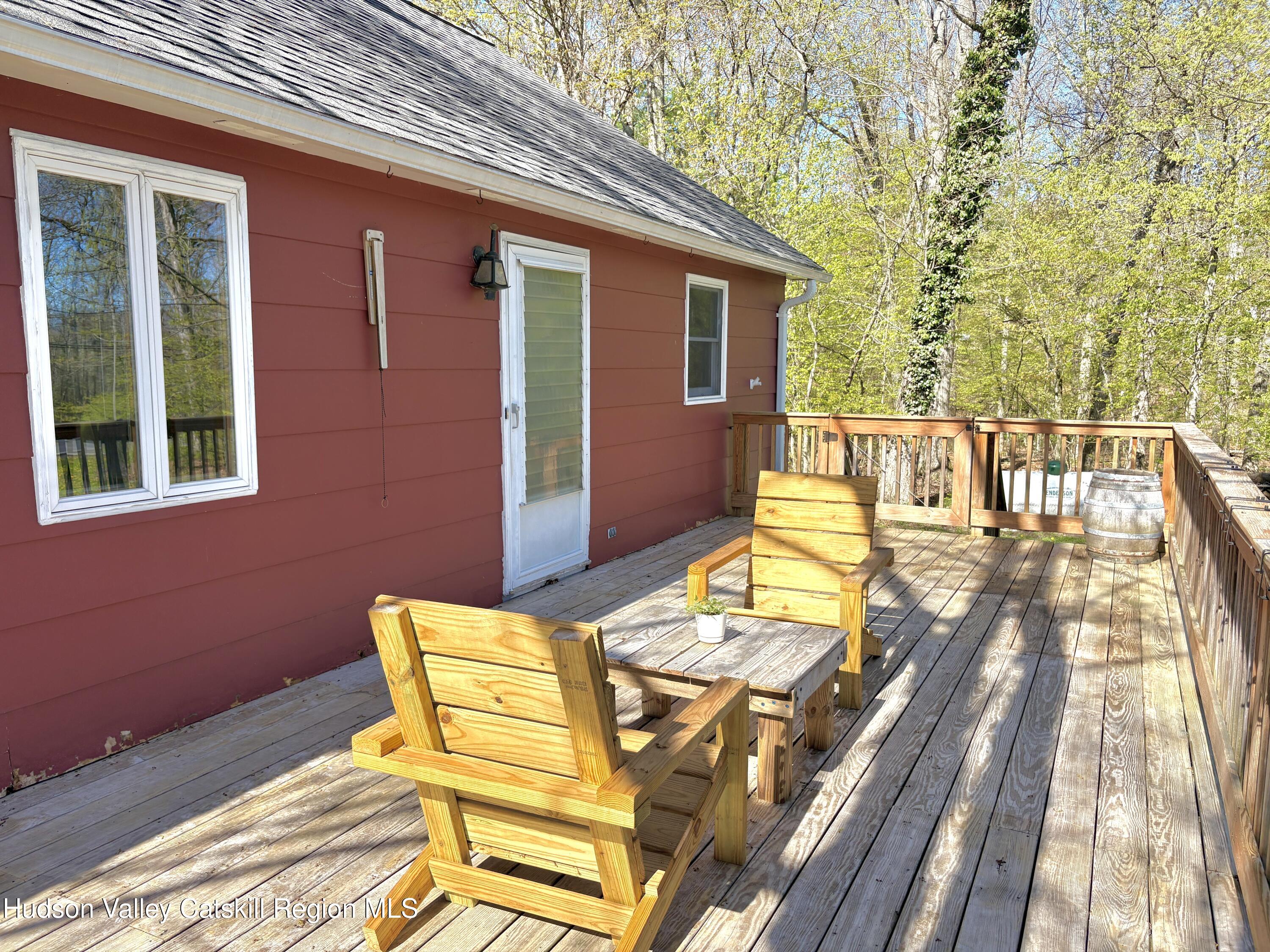 81 Mountain Turnpike Road Catskill, NY 12414 - Photo 2 of 36 a view of a balcony with two chairs and a table