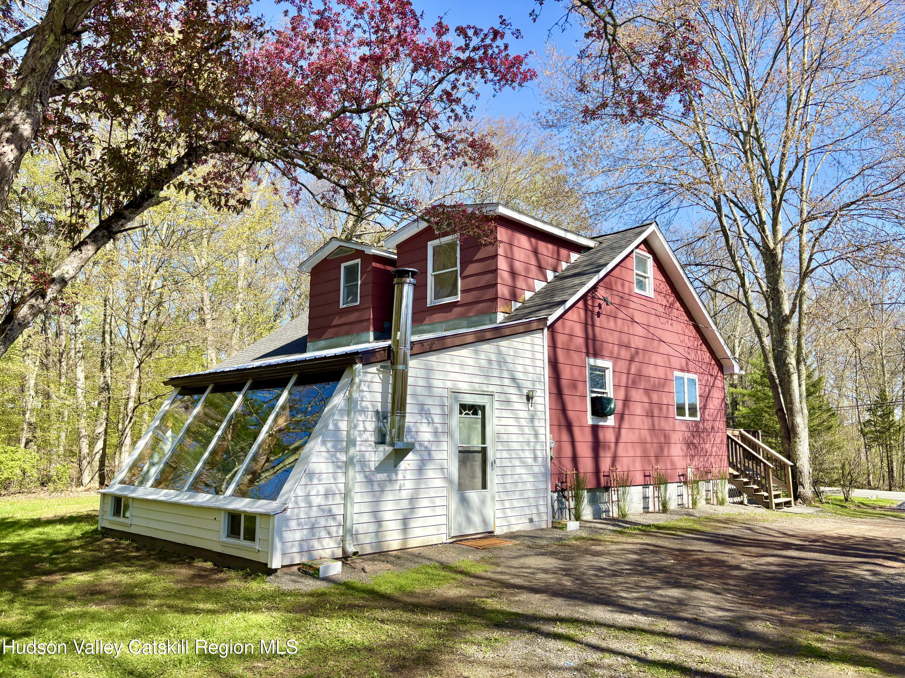 81 Mountain Turnpike Road Catskill, NY 12414 - Photo 27 of 36 a front view of a house with a garden