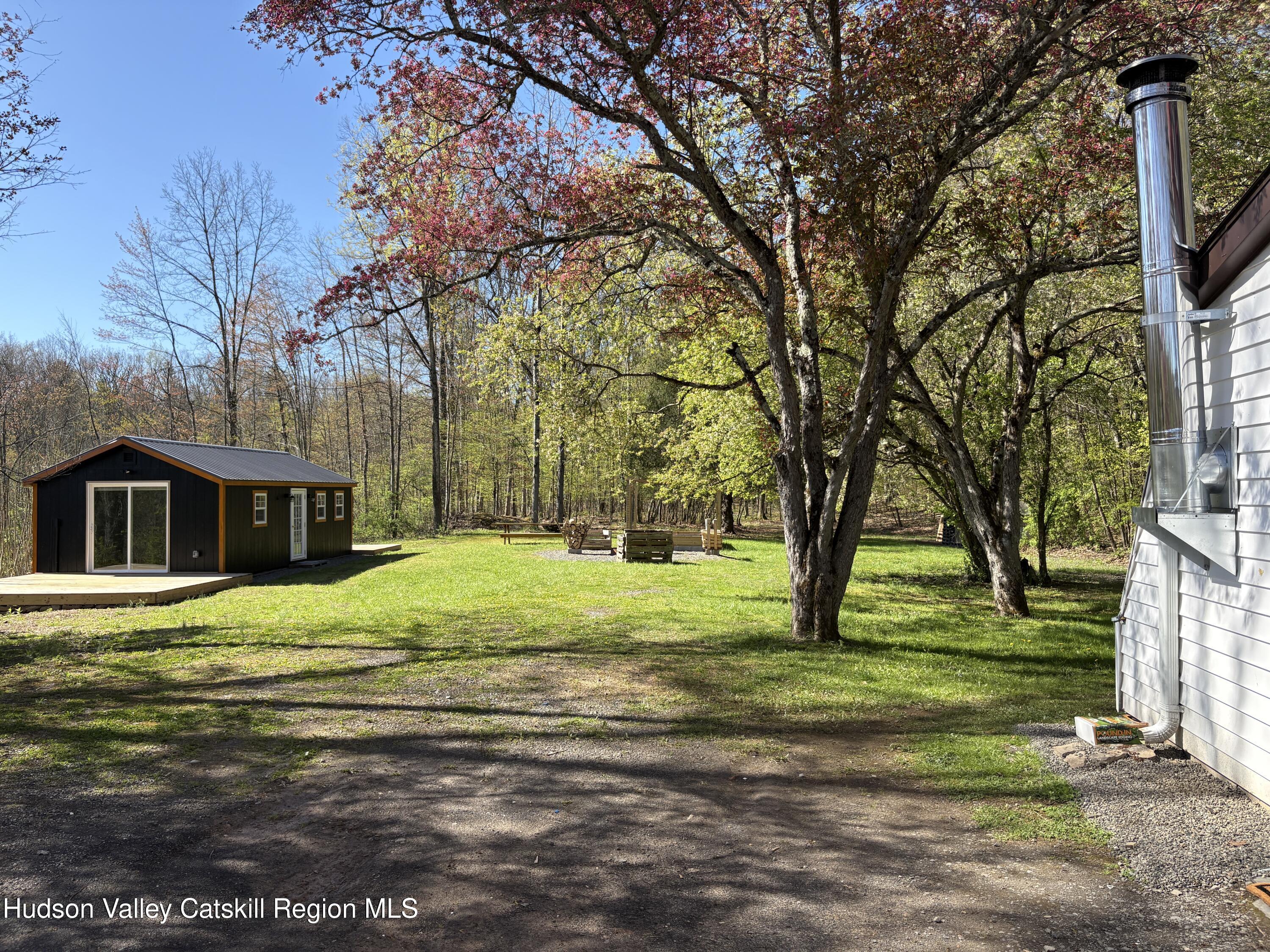 81 Mountain Turnpike Road Catskill, NY 12414 - Photo 28 of 36 a big yard with trees in the background