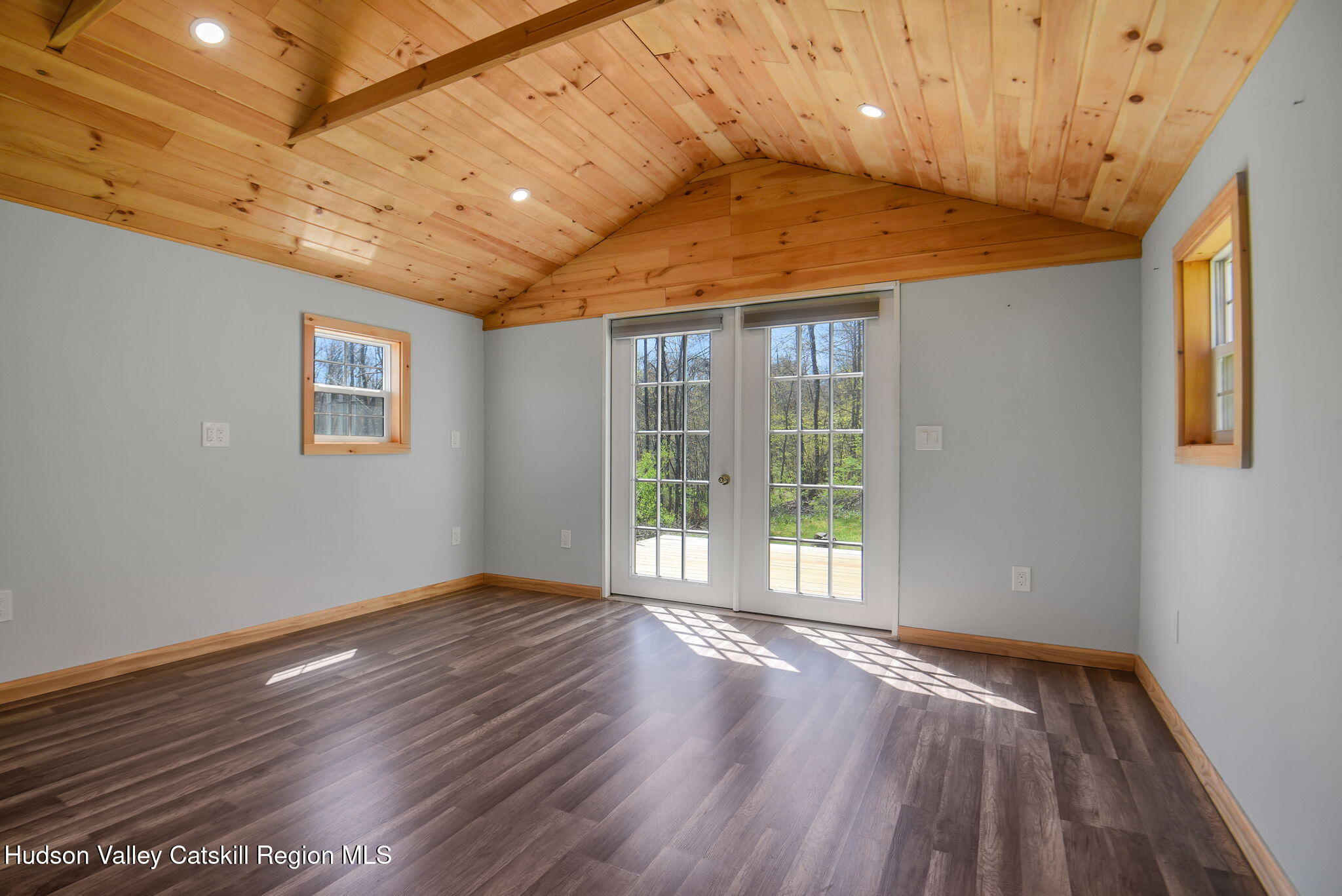 81 Mountain Turnpike Road Catskill, NY 12414 - Photo 32 of 36 a view of an empty room with wooden floor and a window