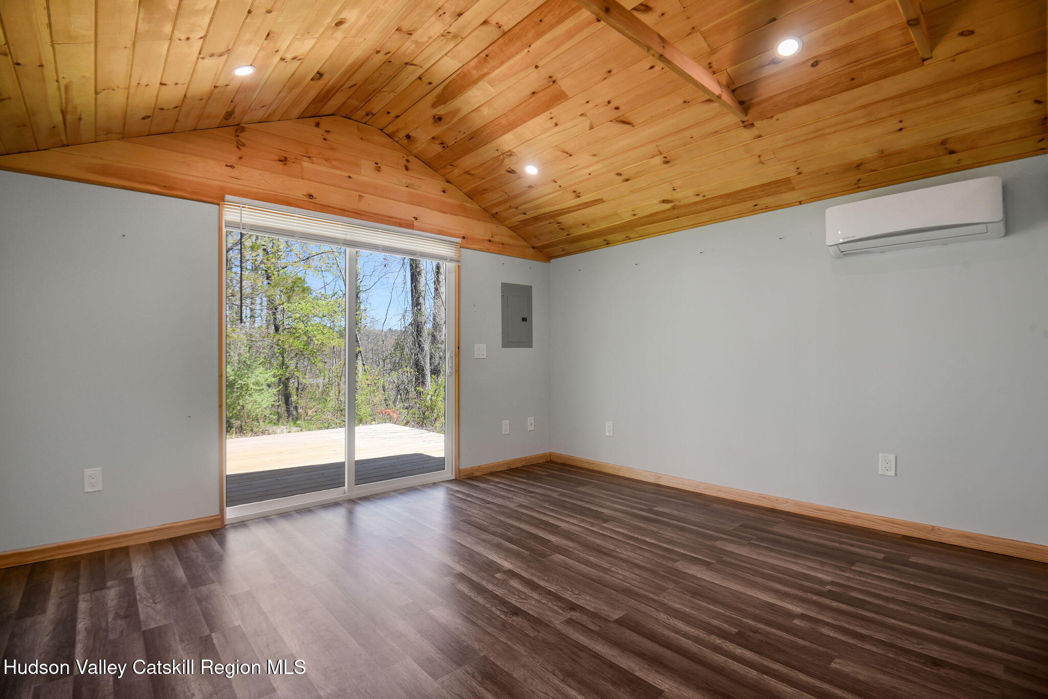 81 Mountain Turnpike Road Catskill, NY 12414 - Photo 33 of 36 a view of an empty room with wooden floor and a window