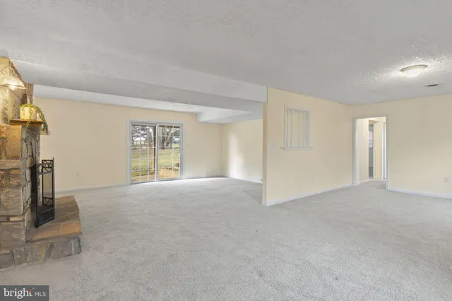 a view of a livingroom with a fireplace