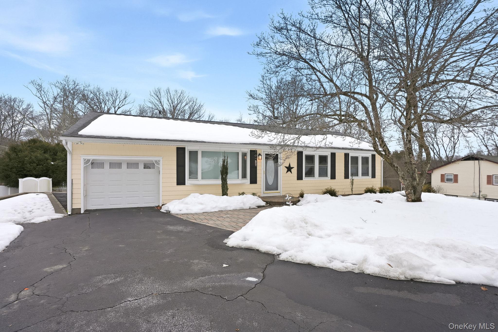 12 Lakeview Road Carmel, NY 10512 - Photo 1 of 31 a front view of a house with a yard and garage