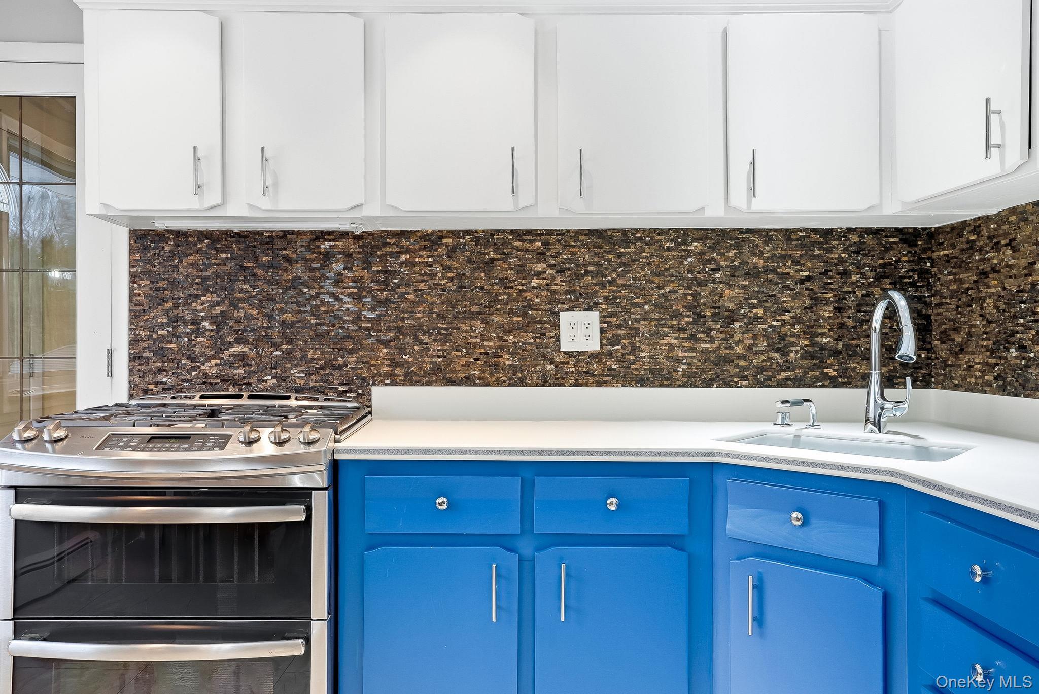 12 Lakeview Road Carmel, NY 10512 - Photo 11 of 31 a kitchen with granite countertop a stove sink and cabinets
