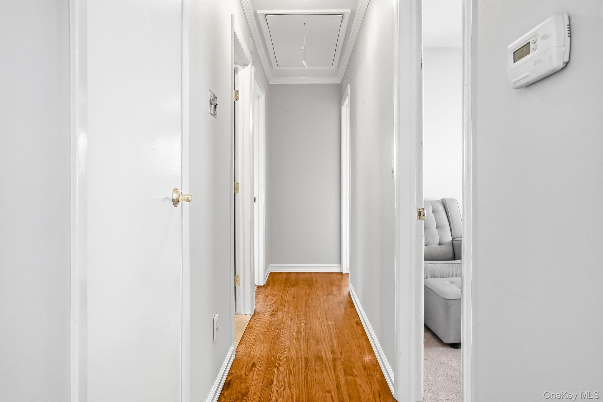 12 Lakeview Road Carmel, NY 10512 - Photo 12 of 31 a view of a hallway with wooden floor and a bathroom