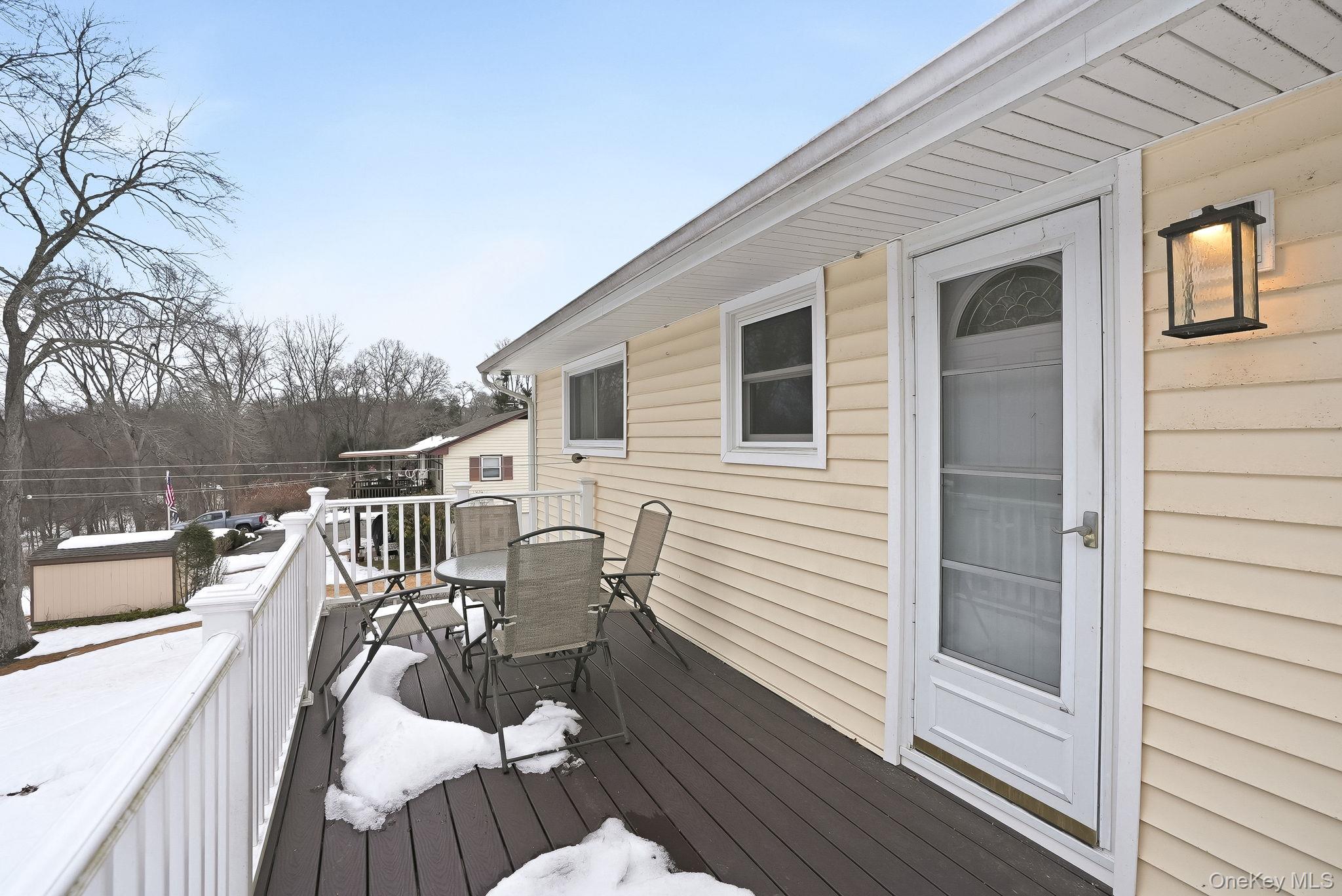 12 Lakeview Road Carmel, NY 10512 - Photo 24 of 31 a view of a roof deck with couches and wooden floor