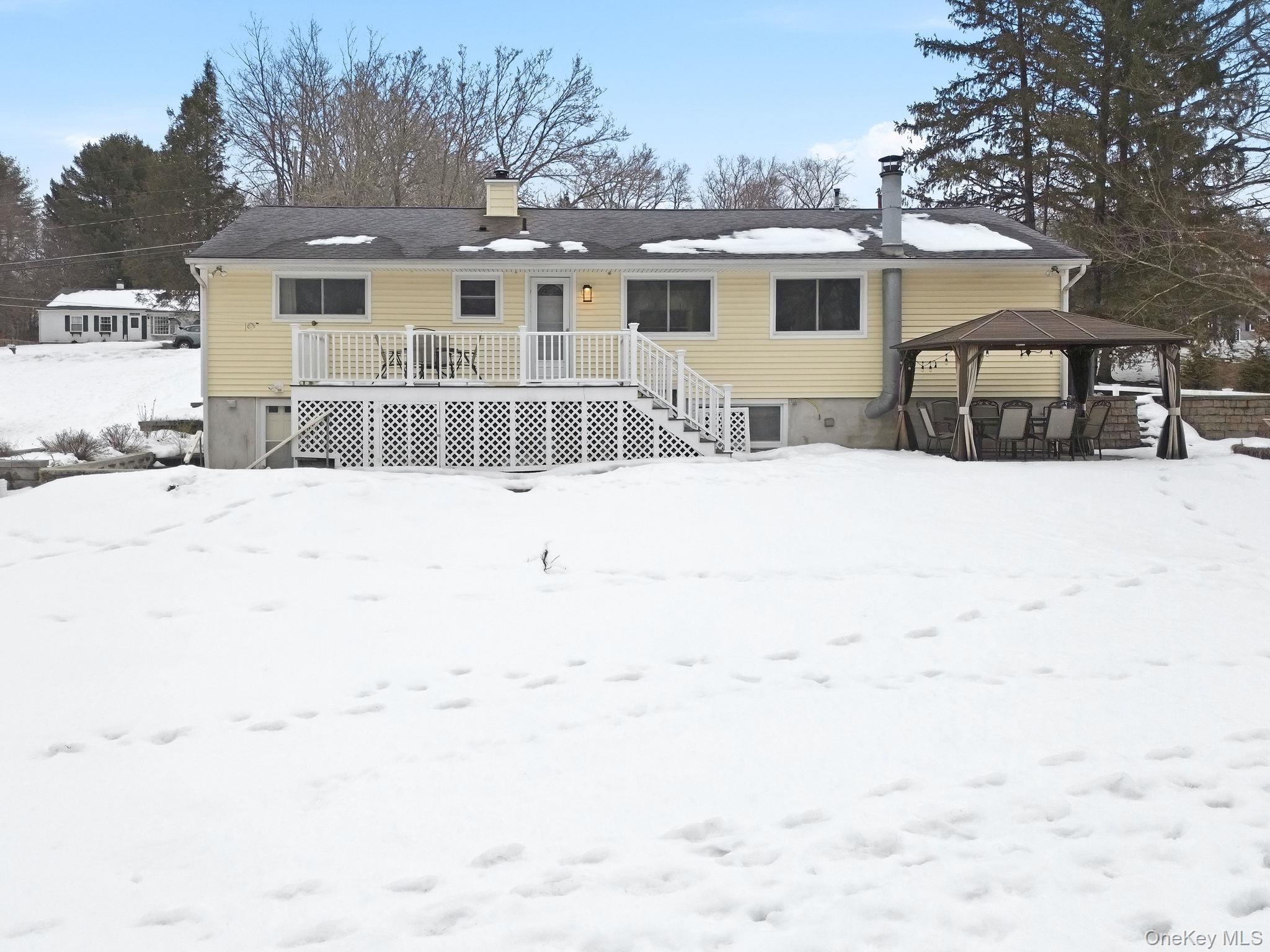 12 Lakeview Road Carmel, NY 10512 - Photo 25 of 31 a front view of a house with a yard covered in snow