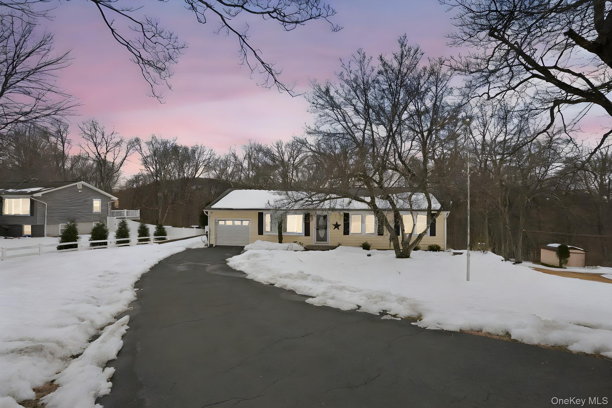 12 Lakeview Road Carmel, NY 10512 - Photo 29 of 31 a front view of a house with a yard covered in snow