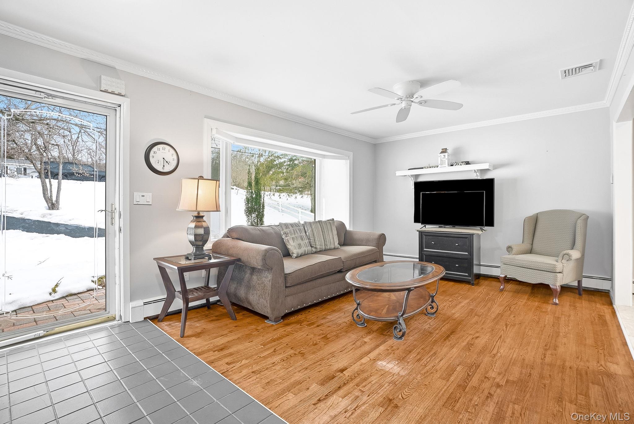 12 Lakeview Road Carmel, NY 10512 - Photo 4 of 31 a living room with furniture and a flat screen tv