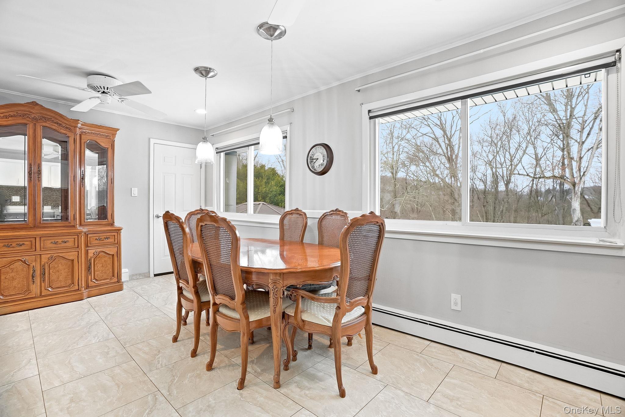 12 Lakeview Road Carmel, NY 10512 - Photo 6 of 31 a view of a dining room with furniture large windows and wooden floor