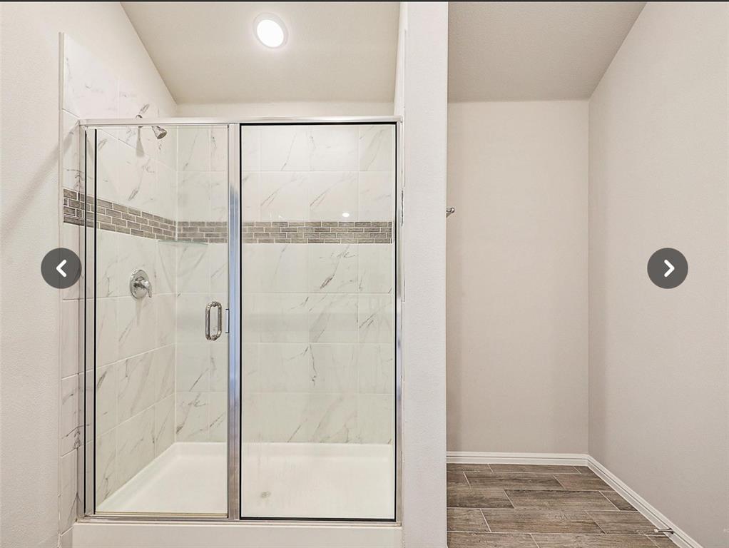14219 Aberavon Drive Pilot Point, TX 76258 - Photo 16 of 25 a bathroom with a glass shower door