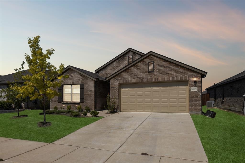 14219 Aberavon Drive Pilot Point, TX 76258 - Photo 3 of 25 a front view of house with yard and green space