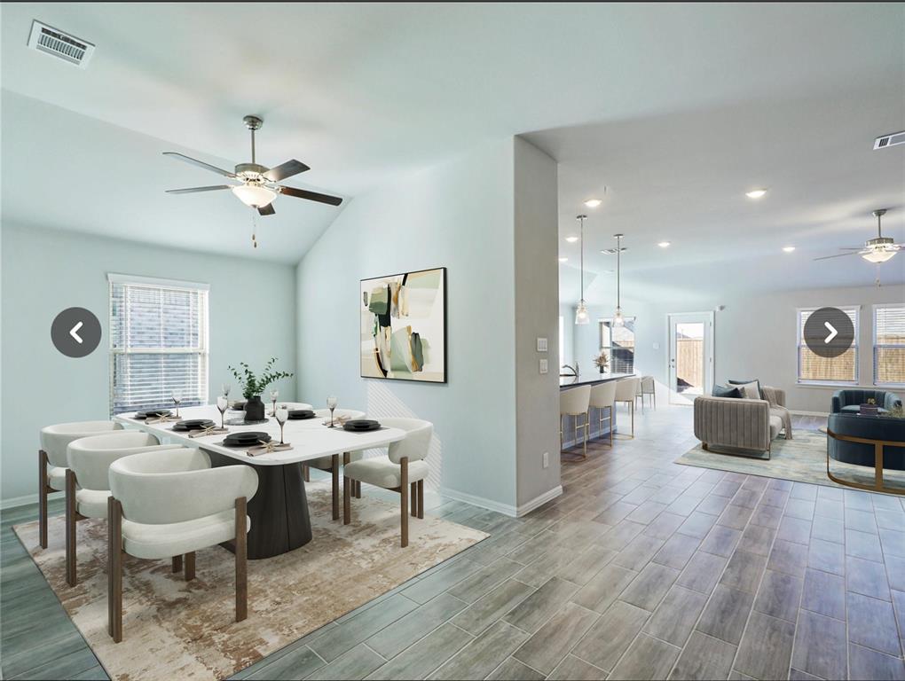 14219 Aberavon Drive Pilot Point, TX 76258 - Photo 6 of 25 a view of a dining room with furniture a chandelier and wooden floor