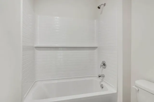 a close view of a bathtub in bathroom