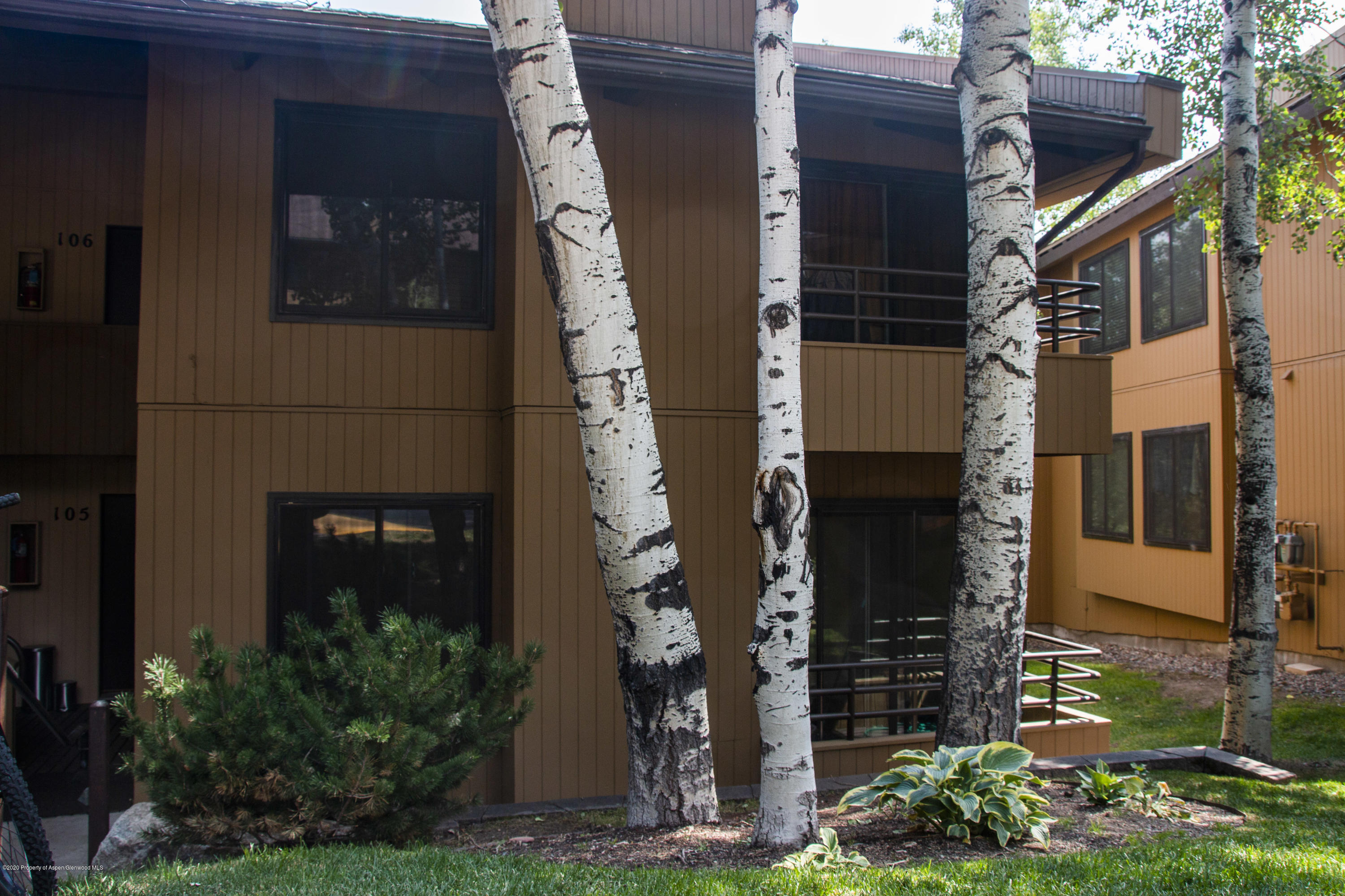 35 Lower Woodbridge Road, Unit 105 Snowmass Village, CO 81615 - Photo 1 of 1 a front view of a house with garden