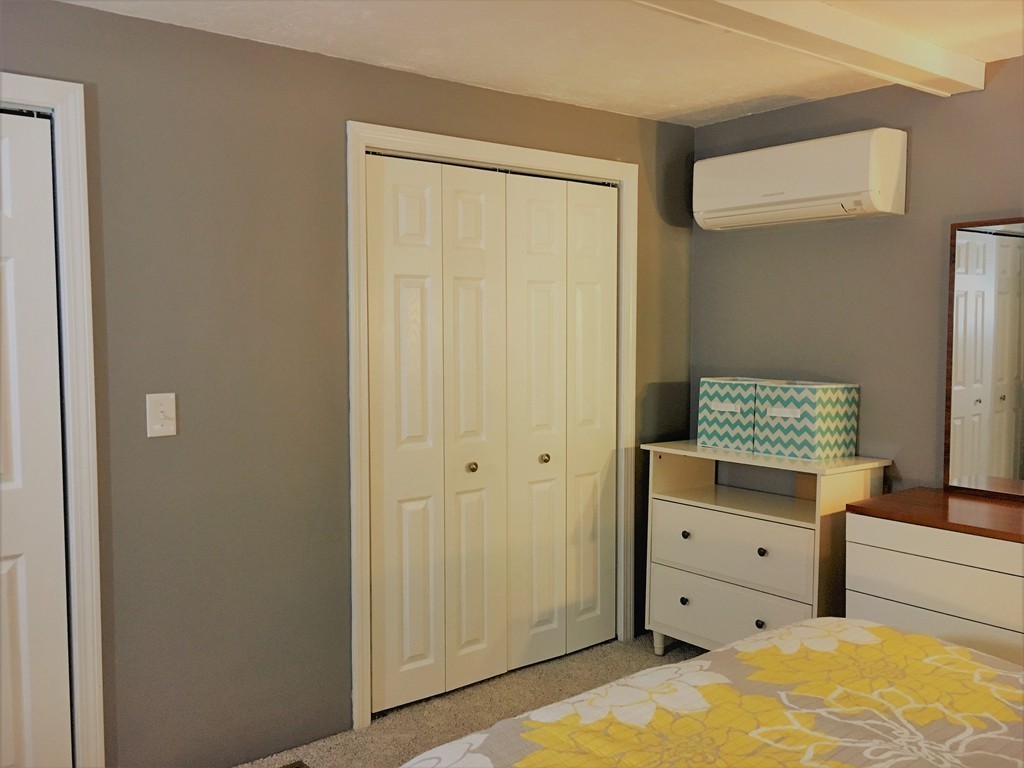 6 Dolan Road Millbury, MA 01527 - Photo 15 of 30 a bedroom with a bed and a dresser in it