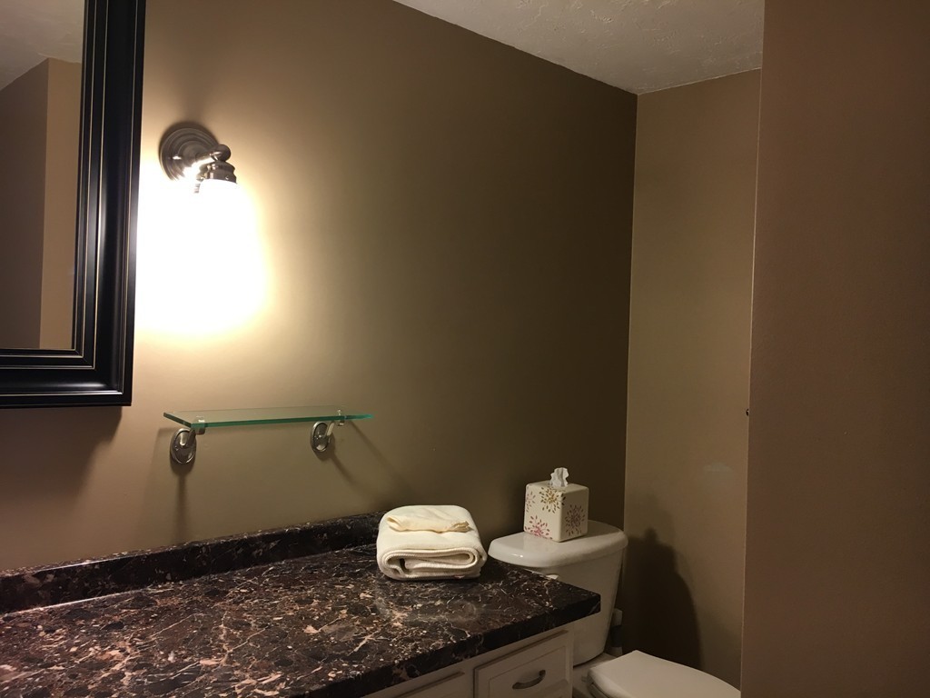 6 Dolan Road Millbury, MA 01527 - Photo 16 of 30 a bathroom with a sink toilet and a mirror