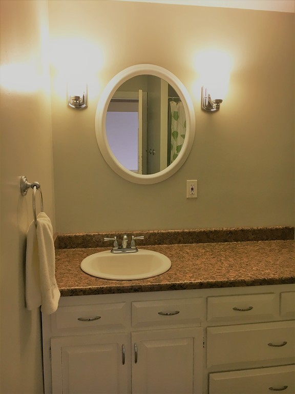 6 Dolan Road Millbury, MA 01527 - Photo 22 of 30 a bathroom with a sink and a mirror