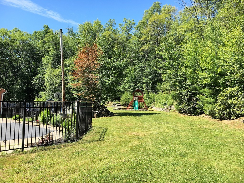 6 Dolan Road Millbury, MA 01527 - Photo 27 of 30 a view of a swimming pool with a patio and a yard