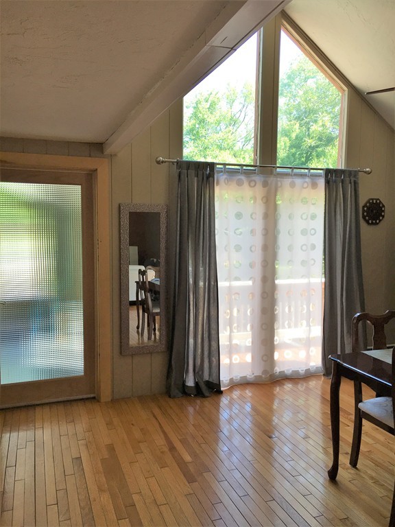 6 Dolan Road Millbury, MA 01527 - Photo 4 of 30 an empty room with wooden floor and a window