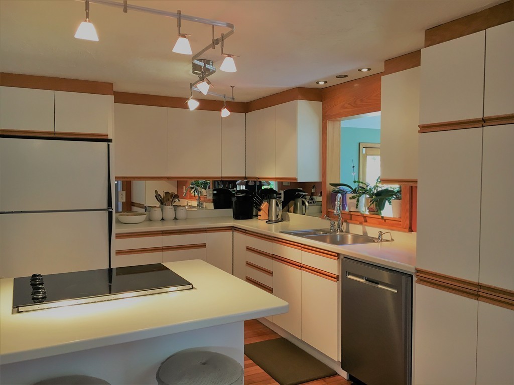 6 Dolan Road Millbury, MA 01527 - Photo 5 of 30 a kitchen with a sink a counter top space cabinets and stainless steel appliances