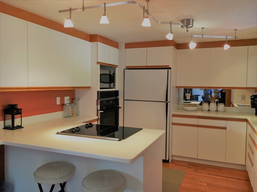 6 Dolan Road Millbury, MA 01527 - Photo 6 of 30 a kitchen with kitchen island a sink appliances and cabinets