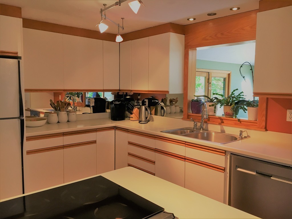 6 Dolan Road Millbury, MA 01527 - Photo 7 of 30 a kitchen with a sink and cabinets