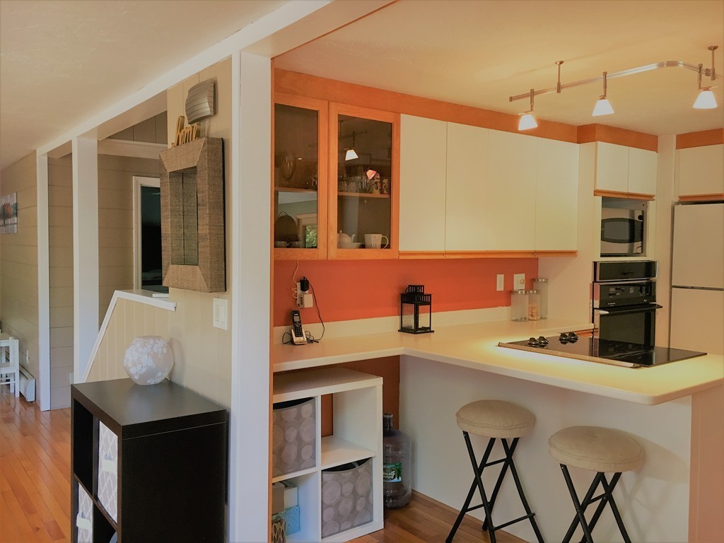 6 Dolan Road Millbury, MA 01527 - Photo 8 of 30 a kitchen with a sink cabinets and wooden floor