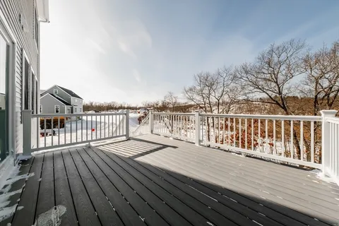 a view of wooden deck and city view