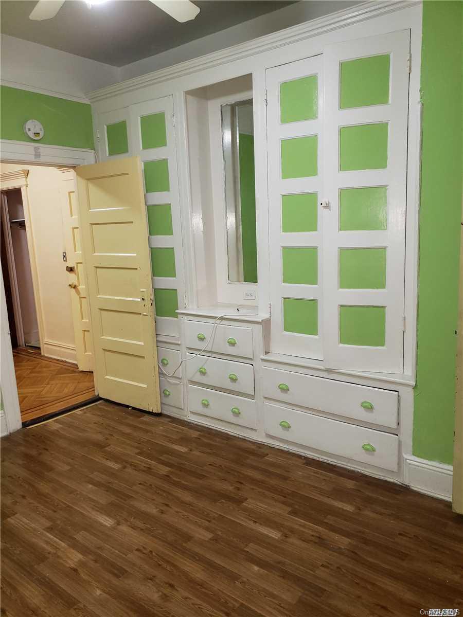 1425 Hancock Street Brooklyn, NY 11237 - Photo 19 of 20 a view of a dresser with wooden floor