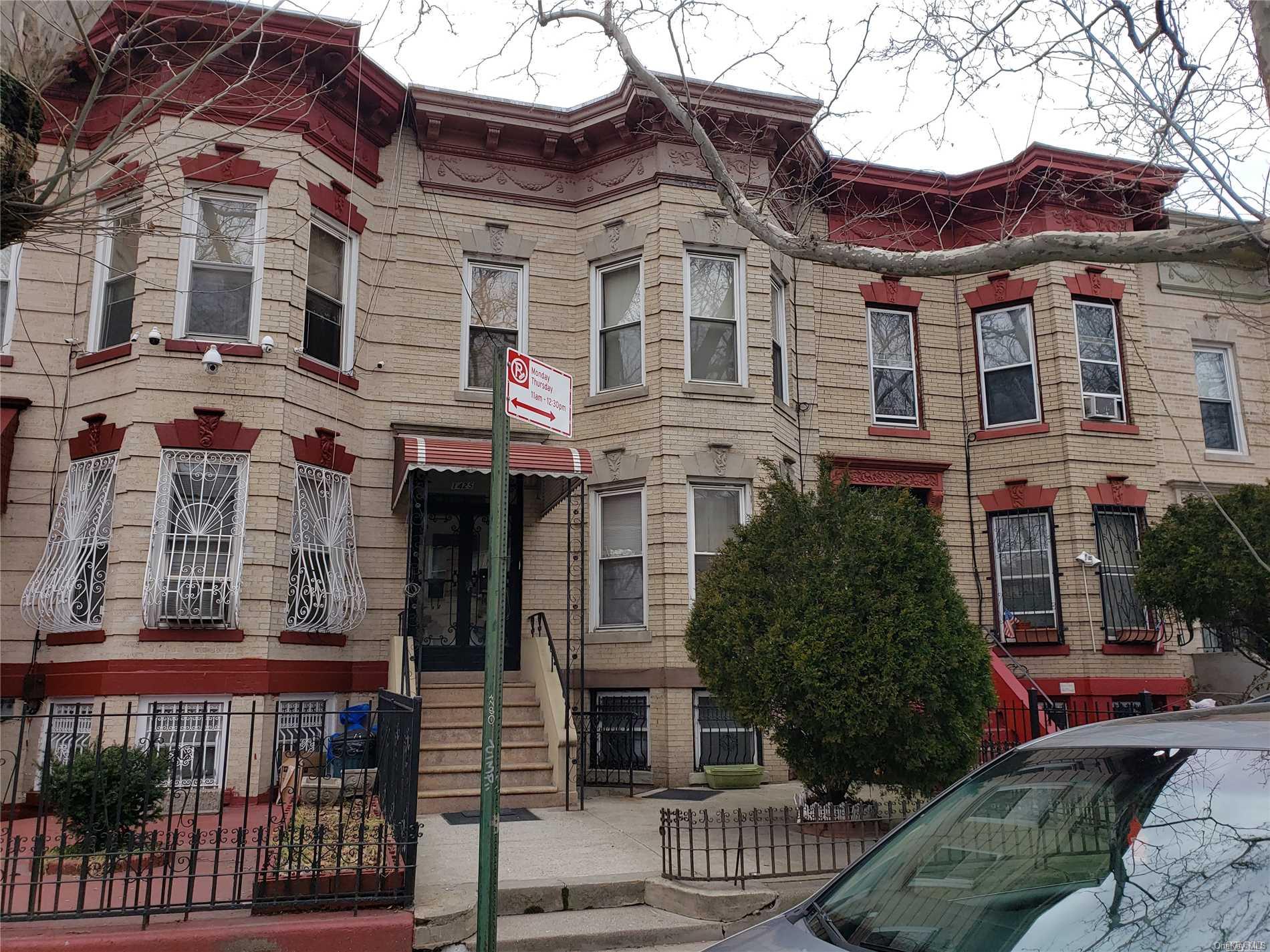 1425 Hancock Street Brooklyn, NY 11237 - Photo 2 of 20 a front view of a residential apartment building with a yard