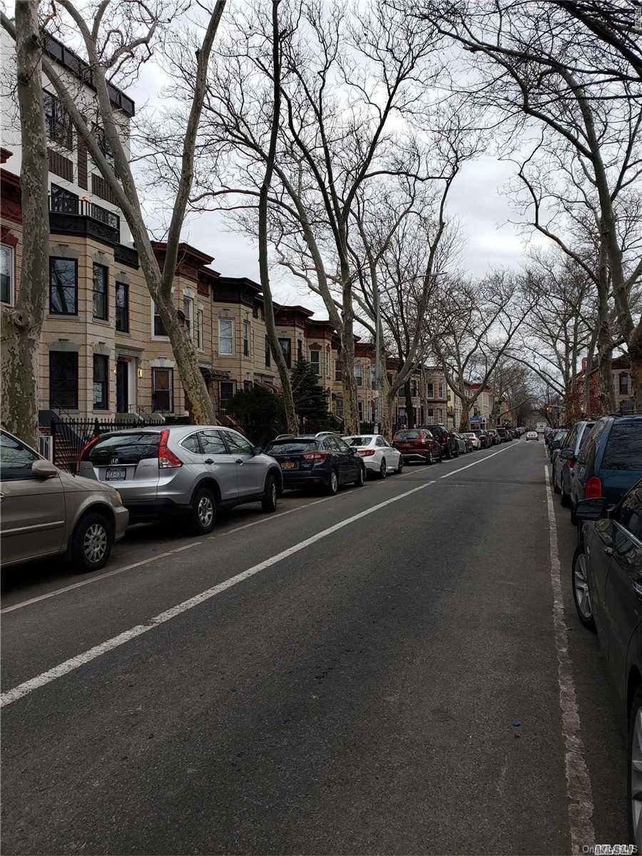 1425 Hancock Street Brooklyn, NY 11237 - Photo 6 of 20 a view of a city street with a large building