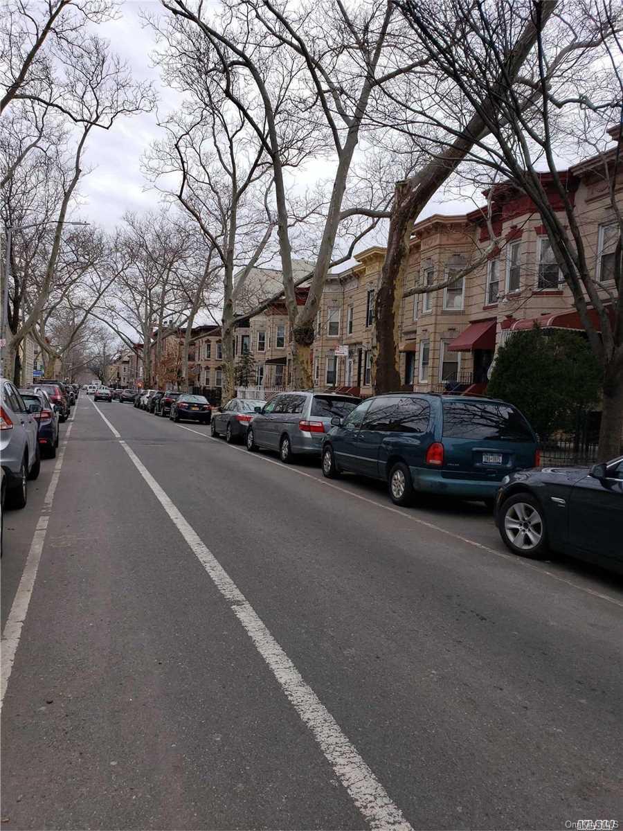 1425 Hancock Street Brooklyn, NY 11237 - Photo 7 of 20 a view of a city street with a car parked on the side of it