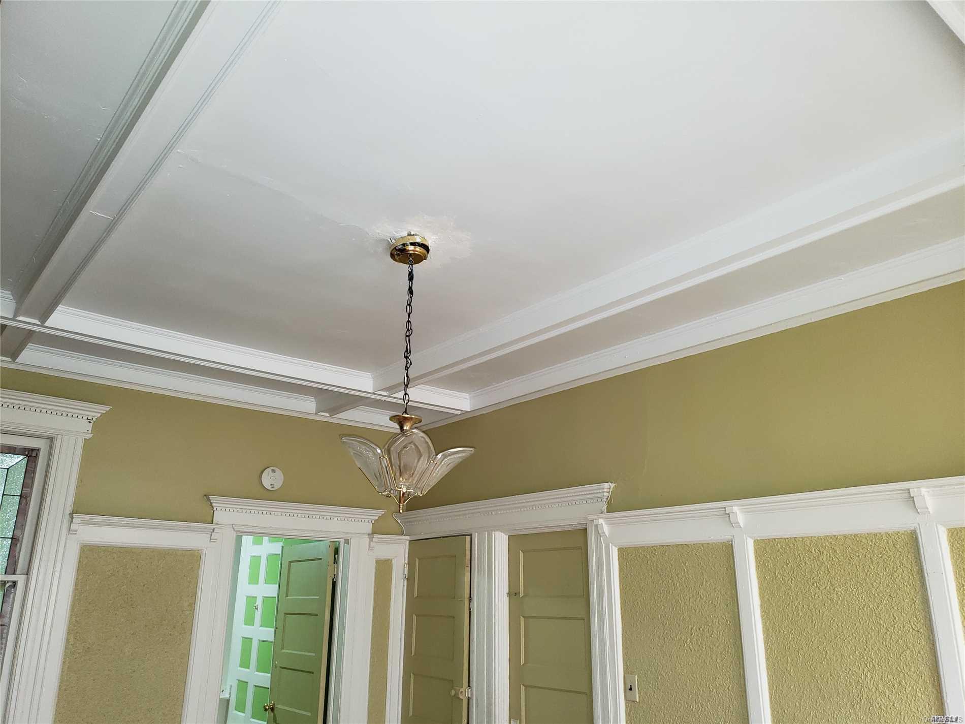 1425 Hancock Street Brooklyn, NY 11237 - Photo 9 of 20 a view of a room with a chandelier