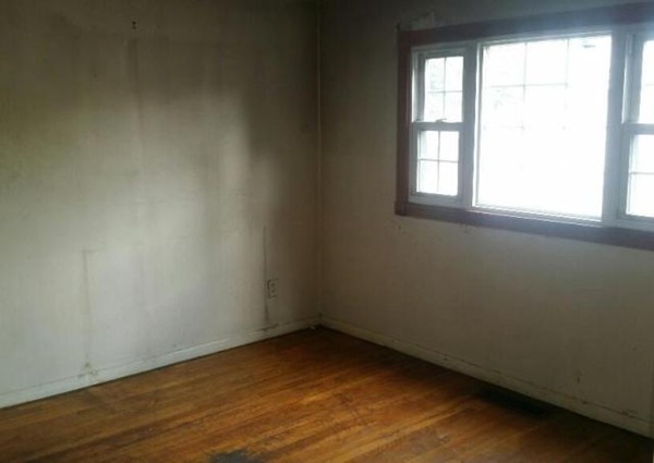 19 Dodge Road Boston, MA 02136 - Photo 8 of 16 an empty room with wooden floor and windows