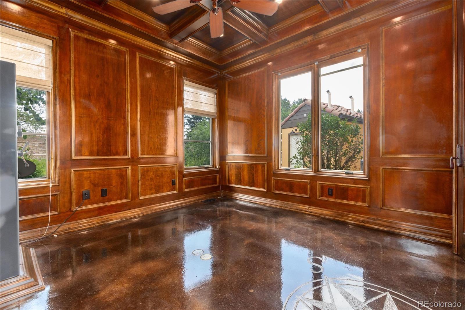 8417 High Ridge Court Castle Pines, CO 80108 - Photo 17 of 48 a view of an empty room with wooden floor and a window