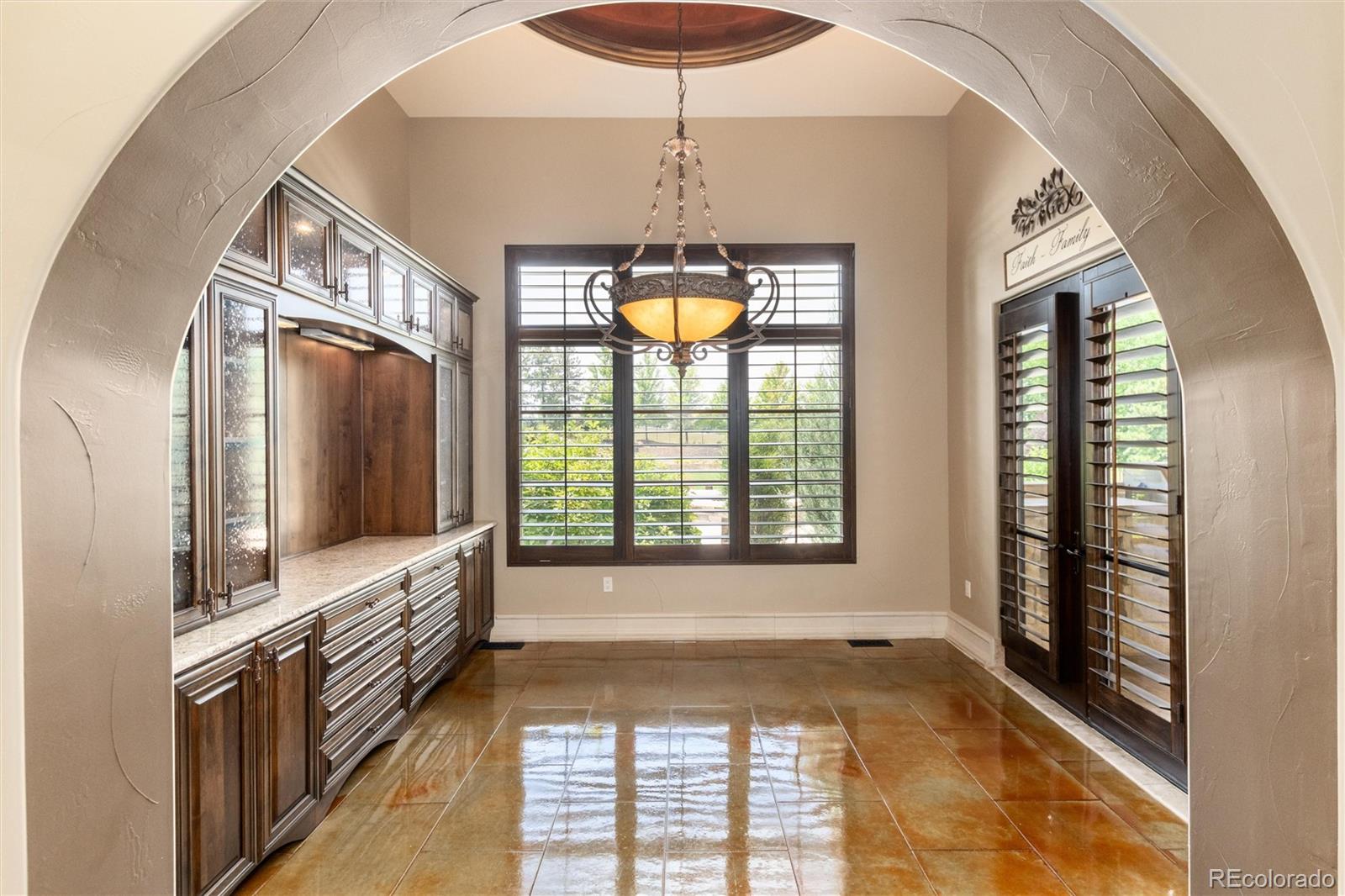 8417 High Ridge Court Castle Pines, CO 80108 - Photo 24 of 48 a view of an entryway with a chandelier